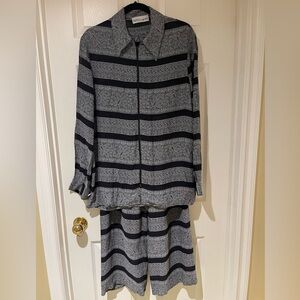 Sz S loose fitting Gray and Black Striped suit made in Italy. Pants fully lined.